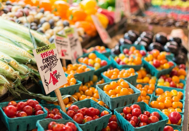 Colorful cherry tomatoes at a farmers market stand